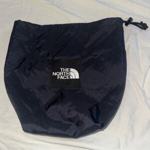 The North Face black storage bag, Laid flat: 16" tall x 11" wide; 7" diameter